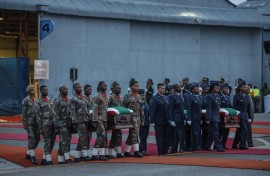 Military pallbearers accompany the caskets of the SANDF soldiers killed in the DRC. AFP/Phill Magakoe