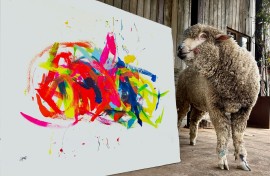 Baanksy the sheep with an original painting. Picture supplied