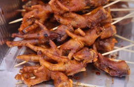 Chicken feet are being displayed at a food stall. Creative Touch Imaging Ltd/NurPhoto via AFP