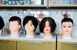 File: Hairdresser training with mannequin heads.GettyImages/Asia-Pacific Images Studio