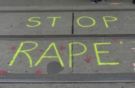 ''Stop rape'' is written on the road by protesters. Debarchan Chatterjee/NurPhoto via AFP