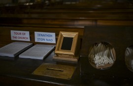 A Point of Sale (POS) device (C) is pictured at the Catholic Church of St Dionysius the Areopagite in Athens. AFP/Aris Messinis