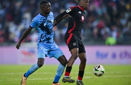 Patrick Maswanganyi of Orlando Pirates challenged by Lehlohonolo Mtshali of Magesi FC. BackpagePix/Alche Greeff