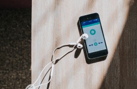 A cellphone displaying a generic music type app. GettyImages/Catherine Falls Commercial