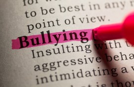 The word 'bullying' in a dictionary. GettyImages/Devonyu