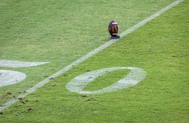 A football sits on a kicking tee. GettyImages/David Madison