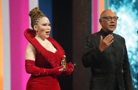 Lelelti Khumalo and Anant Singh receive an award at the Monte Carlo Television Festival