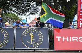 Fans with flags during the 2025 Comrades Marathon. Darren Stewart/Gallo Images