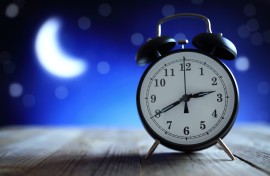 Alarm clock in the middle of the night. GettyImages/BrianAJackson