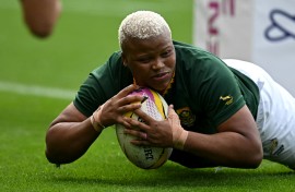 South Africa's Aseza Hele scores a try during the Women’s Rugby World Cup pool D match. AFP/Paul Ellis