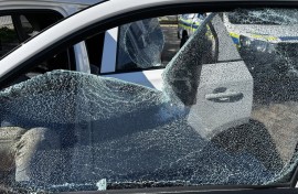 Shattered window of a vehicle Ian Cameron, Nicholas Gotsell and Lisa Schickerling were travelling in when they were attacked in Philippi, Western Cape 