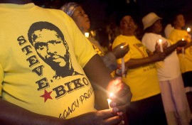 File: Members of SOPA hold a candlelight memorial to mark the death anniversary of the anti-apartheid activist Steve Biko. AFP/Rajesh Jantilal