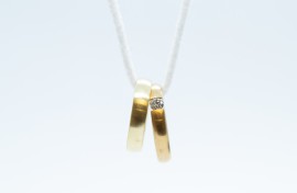 File: Wedding rings on a chain. Friso Gentsch/dpa via AFP