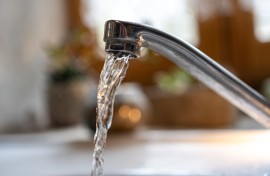 File: Water flowing from a kitchen tap. Isabelle Souriment/Hans Lucas via AFP