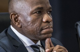 South African Provincial Police Commissioner Nhlanhla Mkhwanazi gestures while giving testimony during the judicial commission of inquiry. AFP/ Phill Magako