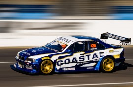 A motorsport vehicle dashes on a race course