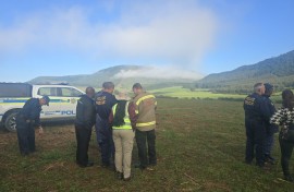 Search teams on the ground near the plane crash. Supplied