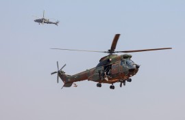 File: A Denel Aeronautics Atlas "Oryx" utility helicopter and a Denel “Rooivalk” (L) attack helicopter. AFP/Phill Magakoe