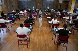 File: Pupils take part in an exam. AP/Sebastien Bozon