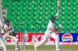 South Africa's captain Aiden Markram (R) is clean bowled by Pakistan's Noman Ali. AFP/Aamir Qureshi