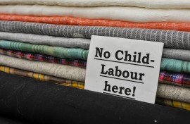 File: Sign advising customers that no child labour is used in the production. GettyImages/Stephen Barnes