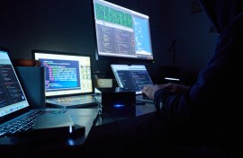 File: Pages and hacker programs are seen on screens. Annette Riedl/dpa via AFP 