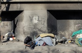 File: A homeless man sleeping under an underpass. AFP/Gianluigi Guercia