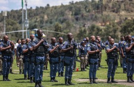 Members of the South African Police Service (SAPS) stand at attention during the Integrated Law Enforcement parade near the Nasrec Expo Centre in Johannesburg, on November 19, 2025.