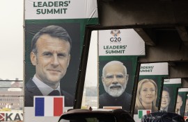 Banners of world leaders displayed on pillars of an highway overpass in Johannesburg. AFP/Gianluigi Guercia