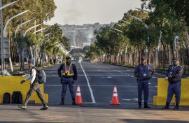SAPS officers monitor the area near the Nasrec Expo Centre in Johannesburg. AFP/Marco Longari