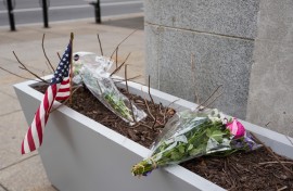 A small memorial of flowers and an American flag has been set up outside the Farragut West Metro station. Andrew Leyden/Getty Images/AFP