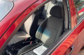 A red Chevrolet Aveo sedan, with a shattered window belonging to Brown Mogotsi