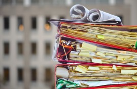 File: A stack of files in an office. GettyImages/thomas-bethge