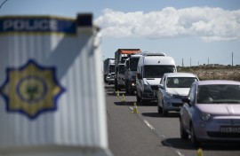 SAPS officers and traffic officials conduct a roadblock on a national highway. AFP/Rodger Bosch