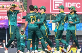 Nandre Burger (2L) celebrates with teammates. AFP/Dibyangshu Sarkar