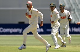 Australian bowler Nathan Lyon (L) celebrates dismissing England batsman Ben Duckett. AFP/William West