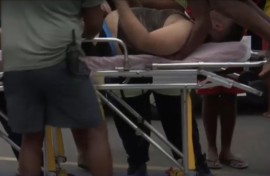 Image of male being rescued from a near-drowning experience at Baggies Beach in Durban.
