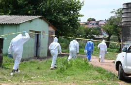 SAPS forensic teams examine a crime scene at Saulsville Hostel. Gallo Images/Frennie Shivambu