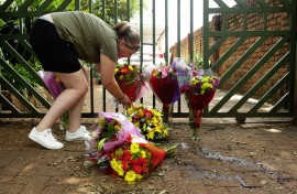 mbers of the public lay flowers in front of the gate after the murder of Marius van der Merwe. Gallo Images/Rapport/Elizabeth Sejake