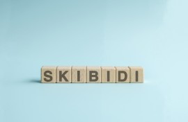 Skibidi text on wooden cube block. GettyImages/Calvin Chan Wai Meng