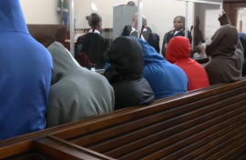 11 officers in the dock