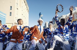 File: Kaapse Klopse minstrels dance as their troupe moves forward during the annual Kaapse Klopse parade. AFP/Gianluigi Guercia