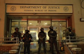 Armed police officers stand in front of the Metropolitan Detention facility in the Brooklyn borough of New York, where ousted president Nicolas Maduro is expected to be held. AFP/John Lamparski