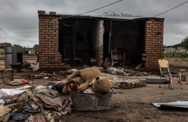 A teddy bear in a tub in front of a damaged house following floods in Mbaula village, 50 km from Giyani. AFP/Paul Botes 