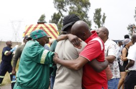 Parents and relatives react at the scene where a scholar transport vehicle crashed in Vanderbijlpark. Gallo Images/Sharon Seretlo