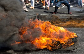 File: Protesters burning rubber tyres in the streets. GettyImages/FourOaks