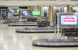 File: An empty baggage claim area at an airport. AFP/Saul Loeb