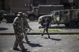  soldiers patrol a residential complex in Westbury, Johannesburg. AFP/Marco Longari