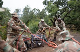 Soldiers recover generators left behind by artisanal miners. AFP/Emmanuel Croset