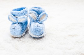 Blue baby booties. GettyImages/oksix